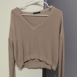 Very light pink Brandy Melville sweater with a v-neck